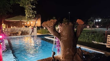 Seasonal outdoor pool, open 8:30 AM to 9:00 PM, pool umbrellas