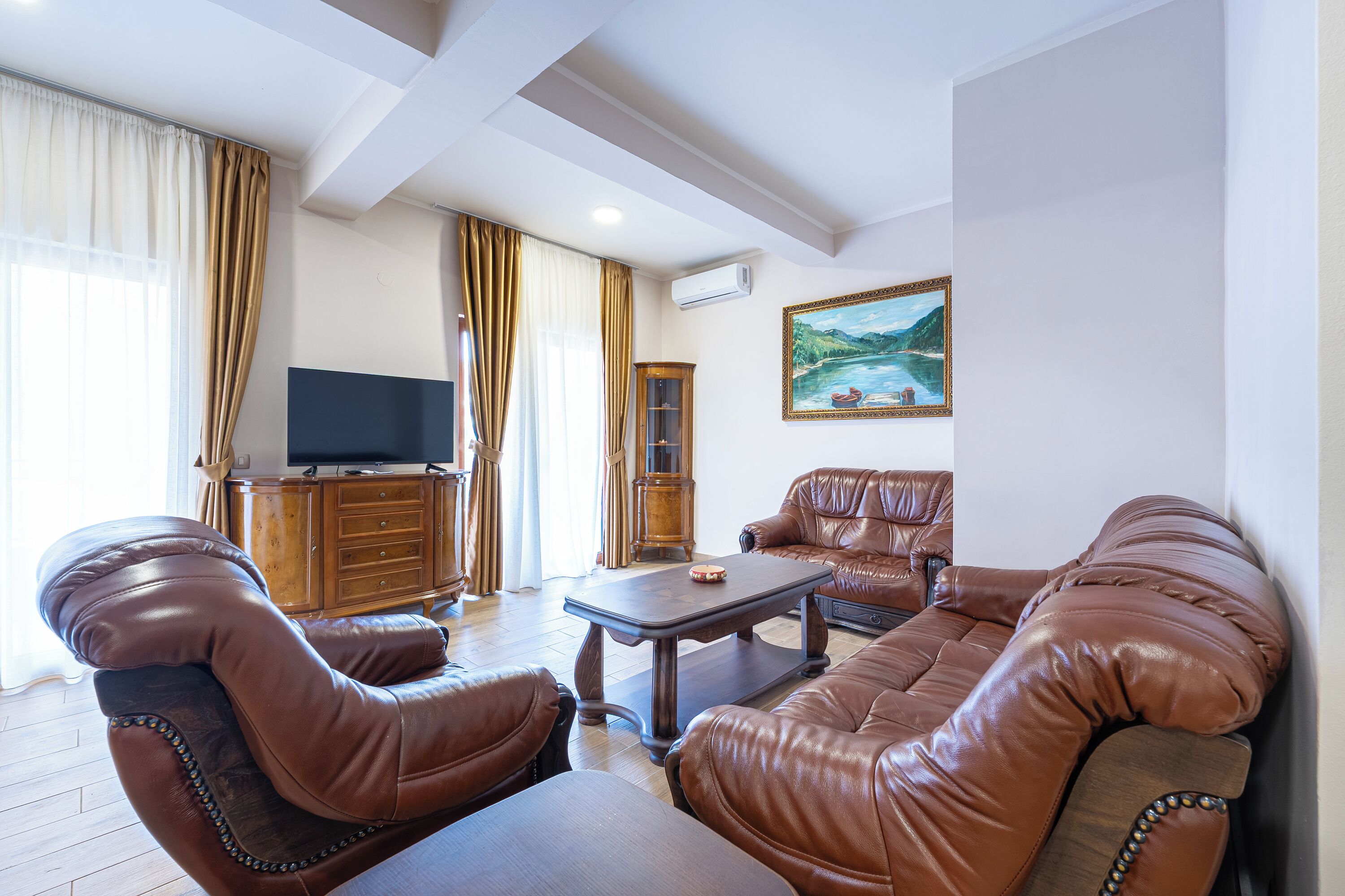 Deluxe Two Bedroom Apartment | Living area | 40-inch Smart TV with satellite channels