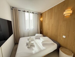 2 habitaciones, tabla de planchar con plancha, wifi y ropa de cama 