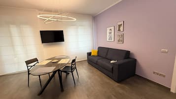 Comfort Apartment | Living area | Flat-screen TV