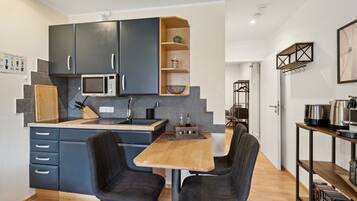 Fridge, microwave, stovetop, coffee/tea maker