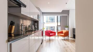 Apartment (410) | Private kitchen | Microwave, blender, cookware/dishes/utensils