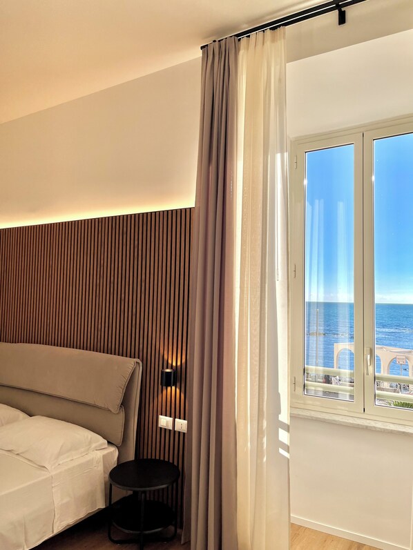 Deluxe Triple Room, Sea View | Desk, laptop workspace, free WiFi