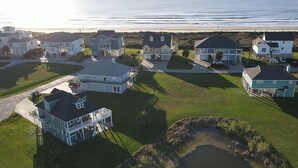A coastal residential area with houses and a small body of water.