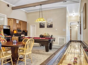 A dining area with a pool table, wooden chairs, a pool table, and a ping pong table. - Bella Vista, Perfect for Groups,  Indoor Pool, 12,000 Sq. Ft !!! (Sevierville)