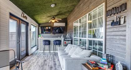 Stylish corner home with cozy interiors, a private bar, and inviting charm