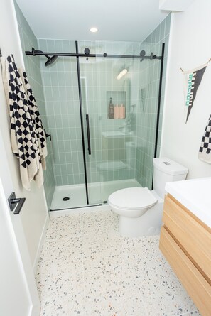 Shower, towels, soap, toilet paper