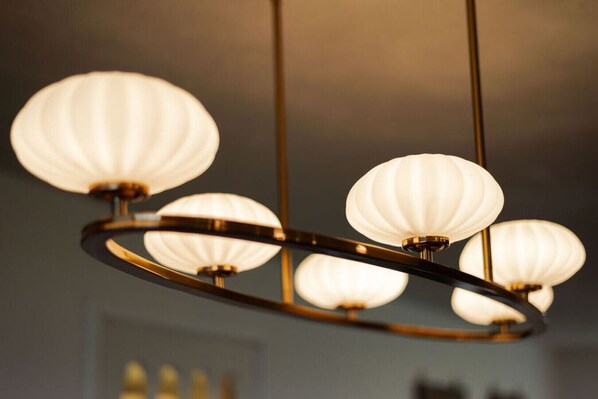 A chandelier with multiple spherical light fixtures.