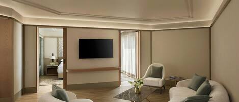 A modern living room with a flat-screen TV mounted on the wall, a sofa set, a coffee table, and a side table with a lamp.