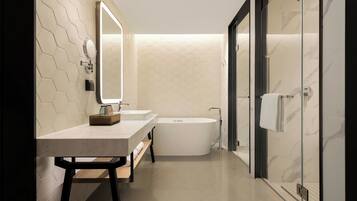 A modern bathroom with a freestanding bathtub, a vanity with a mirror, and a towel rack.