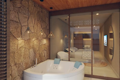 Eco-friendly toiletries, hair dryer, slippers, towels