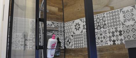 Shower, hair dryer, towels, shampoo