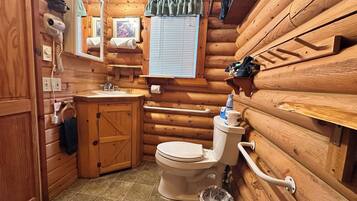 Regadera, secadora de cabello, toallas