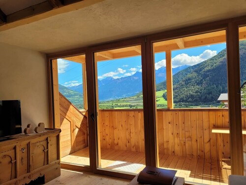 Appartement "Hoamisch" avec vue sur les montagnes, jardin privé et Wi-Fi