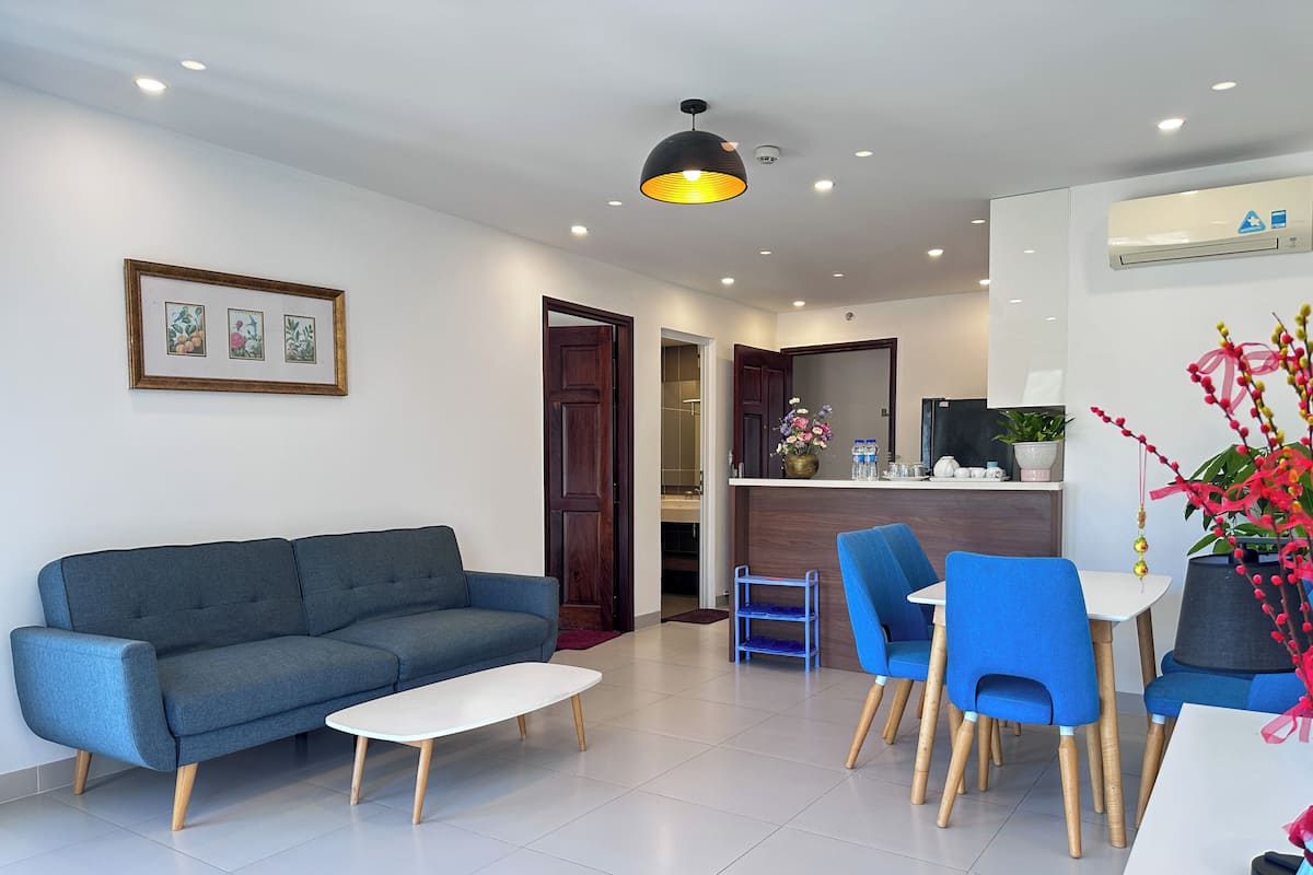 Deluxe Apartment, 2 Bedrooms, Balcony, Sea View | Living area | 65-inch LED TV with cable channels, streaming services