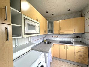 Fridge, microwave, toaster, cookware/dishes/utensils