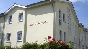 A building with the name "Haus Victoria" on its facade.
