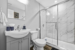 Shower, hair dryer, towels, shampoo