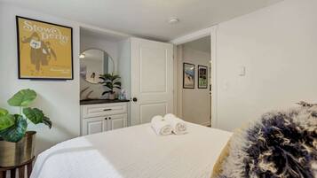 1 bedroom, desk, iron/ironing board, travel crib