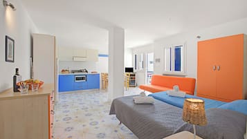 Standard Studio, Sea View (Complesso Azzurro Mono 1 Near The) | Living area | 21-inch flat-screen TV with cable channels