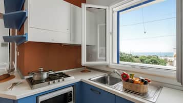 Standard Apartment, Multiple Bedrooms (Complesso Azzurro 1 Near The Beach) | Private kitchen | Fridge, microwave, stovetop, coffee/tea maker