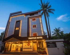 A modern hotel with a prominent sign reading "PRESTIGE HOTEL". - FabHotel Prestige - Nr. Mapusa Bus Stand (Guirim)
