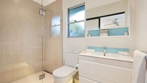 Shower, hair dryer, towels