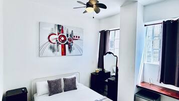 Deluxe Suite, City View | 1 bedroom, hypo-allergenic bedding, down duvets, pillow-top beds