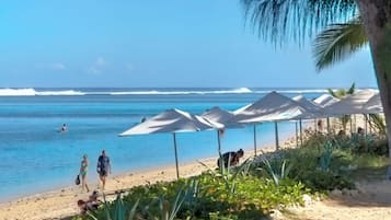 On the beach, sun-loungers, beach towels