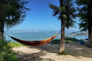 On the beach, sun loungers, beach towels