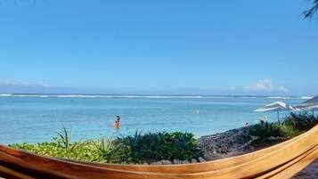 On the beach, sun loungers, beach towels