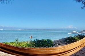 On the beach, sun loungers, beach towels