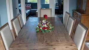 A dining room with a wooden table, chairs, and a chandelier. - Paddy's Atlantic View! Home for 8 in Waterville! (Waterville)