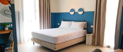 Deluxe Studio | In-room safe, desk, blackout drapes, iron/ironing board