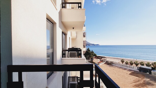 A balcony with a view of the sea and a mountain in the distance. - CASA AL MARE by Moskva (Becici)
