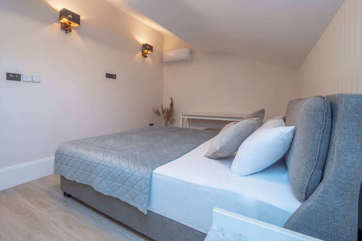 Familie suite | 2 slaapkamers, luxe beddengoed, een kluis op de kamer, een bureau