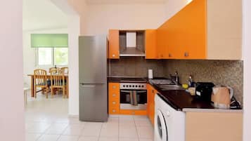 Family Chalet | Private kitchen | Fridge, microwave, stovetop, high chair