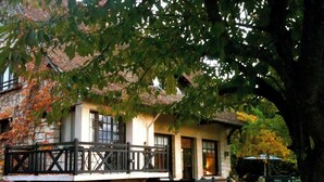A traditional stone building with a balcony, arched windows, and a stone bridge leading to the entrance. - Countryside Villa for Week-End ,week/holidays 1 Hour from Paris for 4/16 persons (Connelles)