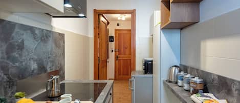 Standard Apartment, Multiple Bedrooms (Montagne E Coccole) | Private kitchen | Fridge, microwave, stovetop, dishwasher