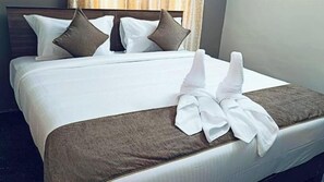 Premium bedding, desk, laptop workspace, soundproofing