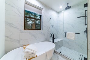 Shower, hair dryer, towels, shampoo