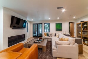 Smart TV, fireplace, foosball, books