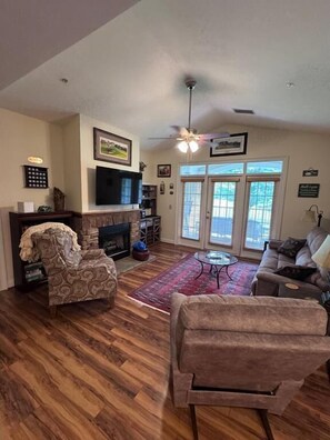 Smart TV, fireplace, books, printers