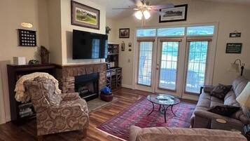 Smart TV, fireplace, books, printers