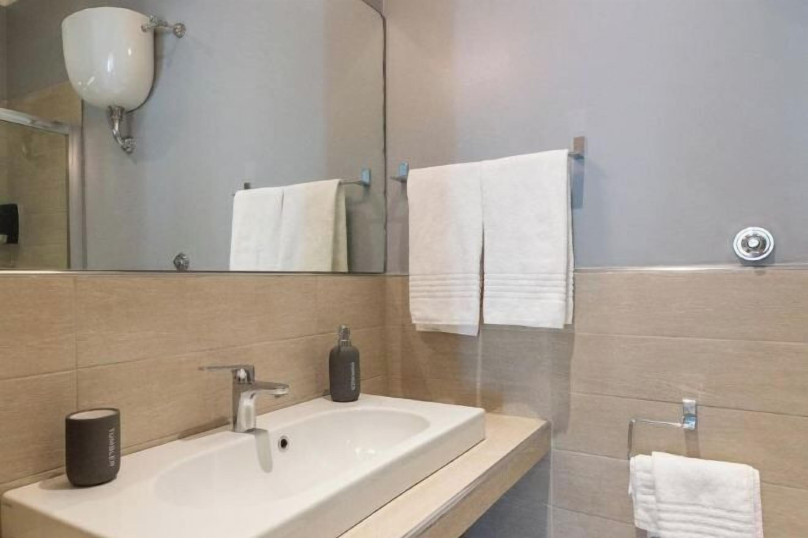 Bathroom | Shower, hair dryer, slippers, towels