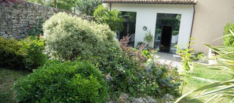Umbria Hideout Villa surrounded by a green view from the garden through the hill