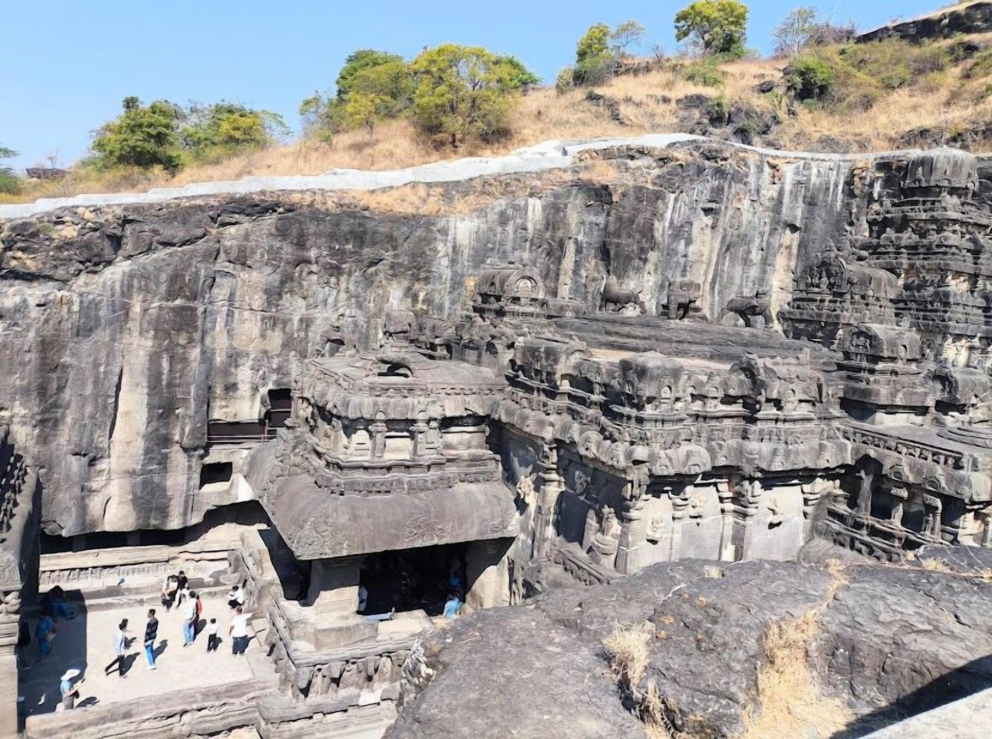 A large rock-cut temple complex with intricate carvings and multiple levels.