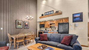 A modern kitchen with wooden cabinets and a built-in microwave. - Mt. Bachelor Village Escape: Hot Tub, Pool, Fireplace & Central Bend Location (Bend)