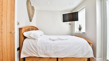 1 bedroom, desk, iron/ironing board, travel crib