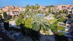 A residential area with multiple apartment buildings, a swimming pool, and well-maintained gardens. - Luxurious Penthouse with Spacious Terrace in Limnaria Gardens, Paphos (Paphos)